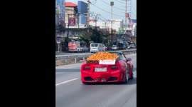 Sports car driver takes a 'fruitful' ride with oranges as marketing strategy