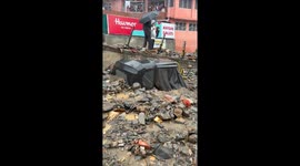 Cars buried in mud after heavy rainfall in Kullu