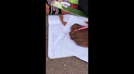 Youngster born without arms shows how he writes with foot