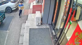 Boy falls backwards when he misses door handle