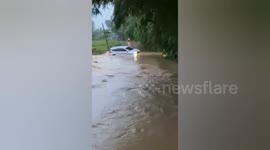Seconds to Car Being Dragged by Flood Current in Bekasi Driver Safe