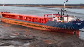 Large ship runs aground in Hull after getting too close to the shoreline and gets stuck on a mud bank