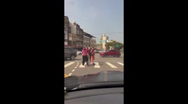 Angry grandmothers seen fighting on zebra crossing