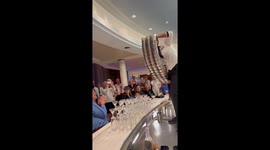 Expert bartender perfectly pours dozens of martinis at once without spilling a drop
