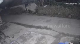 Three men driving a motorbike at high speed collided with a black dog going in the opposite direction