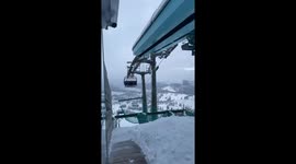 Young Skiers Sing On Chairlift