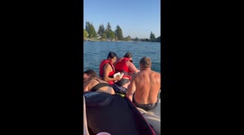 Couple comically falls into the water after jet ski tips over
