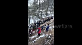 Chinese villagers uses ropes to pull stranded truck up mountain in Herculean effort