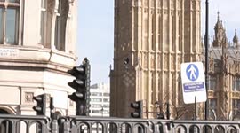 Barefoot Palestinian protester scales Big Ben with the flag of Palestine