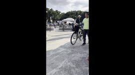 Puppy sits in owner's bicycle basket