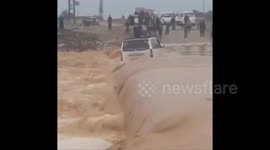 Syria: Heavy rains caused flooding in Wadi Ali to wash away a civilian's car on the Suwaya Bridge in the town of Al Bukamal, east of Deir Ezzor