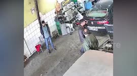 Garage workers stunned by explosion after airbag thrown into stove