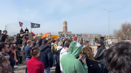 People demonstrate in the area in front of the old lighthouse following the construction of a fence that limits access to the beach in front of the historic fishing platforms, in Fiumicino near Rome.