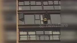 China: Hero Firefighters Save Girl Trapped on Ledge as Neighbors Use Blankets to Help
