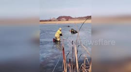 Firemen rescue fisherman stuck on frozen lake in Donetsk, Russia