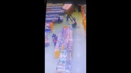 Forklift topples over burying female customer under boxes in Brazil