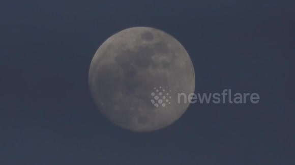 The March Full Moon known as the Worm Moon rises in Cambridge