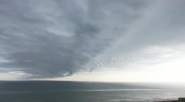US: Storm clouds over the ocean in Ormond Beach