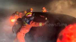 Blizzard chaos in China sees dozens trapped in snow and firefighters racing to rescue stranded drivers