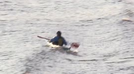 Rower In A Canoe Got Into Difficulty While Paddling In The River Thames