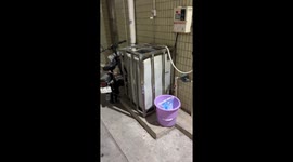 Washing machine moves inside a cage in Guangdong, China