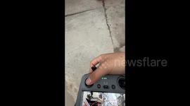 China: A Drone Spinning on a Power Line