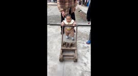 Toddler in China learns to walk with 37-year-old wooden walker