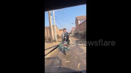 China: A Failed Improvisation on Trailing a Scooter