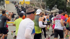 The Guardia di Finanza band plays as runners pass by during the Acea Run Rome The Marathon in Rome.