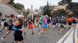 The Guardia di Finanza band plays as runners pass the Campidoglio steps in the background during the Acea Run Rome The Marathon in Rome.