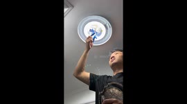 Chinese electrician fixes live wires with taped fingers
