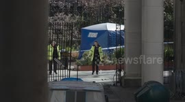 Police erect a tent after confirmation of van crash fatality in London's Aldwych