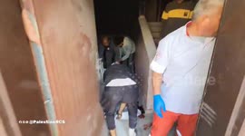 Palestine Red Crescent crews retrieving the bodies of two individuals from the Saudi 2 neighborhood in Tel Al-Sultan