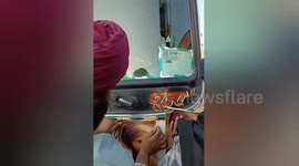 Supporters of Sikh militant plaster posters across buses in Punjab