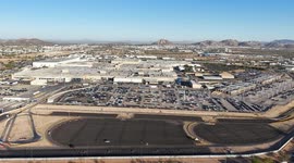 Aerial view of the Ford Motor Company automotive company in the Hermosillo industrial park, Sonora Mexico. Hundreds of new cars ready and arranged in order in the yard to be transported in train cars to the Automotive Industry market in the USA. Hermosill