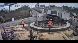 Car loses control and plummets into construction pit, narrowly missing unaware worker