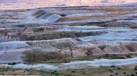 Aerial view of a massive open pit lignite mine with stunning geological formations and industrial impact.