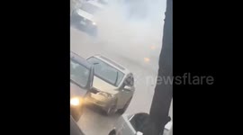 Israeli forces fire tear gas canisters at Palestinian vehicles during their raid on Yatta town