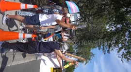 Democrats protesting Elon Musk outside of a Tesla Dealership