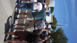 Democrats protesting Elon Musk outside of a Tesla Dealership