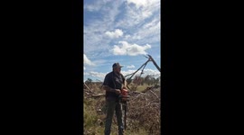 Stubborn chainsaw finally starts after guy uses the 'Australian Way' to get it working