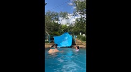 Dad gets flung from side-to-side on rough waterslide