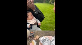 Little boy's 'hello' creates ripples of happiness at a girl's picnic