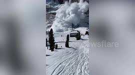 Terrifying moment avalanche comes crashing down - engulfing skiers in cloud of snow