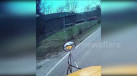 Pupil steps out from school bus narrowly avoiding oncoming car