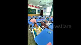 Tibetan school installs reclining desks that allows students to nap in order to 'enhance learning efficiency'