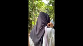 Lady falls while posing for the camera in Langkawi, Malaysia