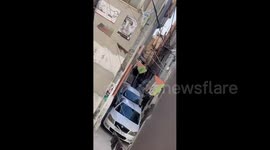 Israeli forces arrest a Palestinian youth during their raid on Askar refugee camp in Nablus