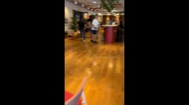 Pool water cascades from Bangkok skyscraper in video filmed from adjacent building