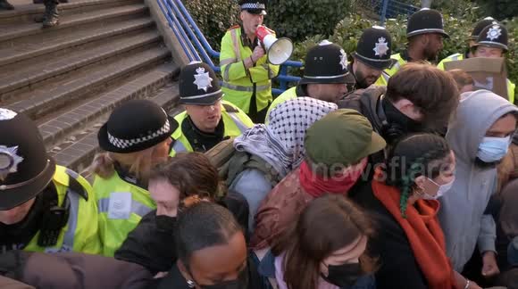 Anti-Farage protesters scuffle with police and block access to Reform rally in Birmingham